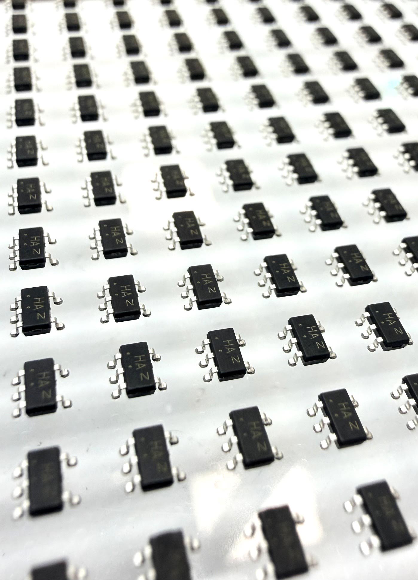 Rows of electronic components with formed metal leads