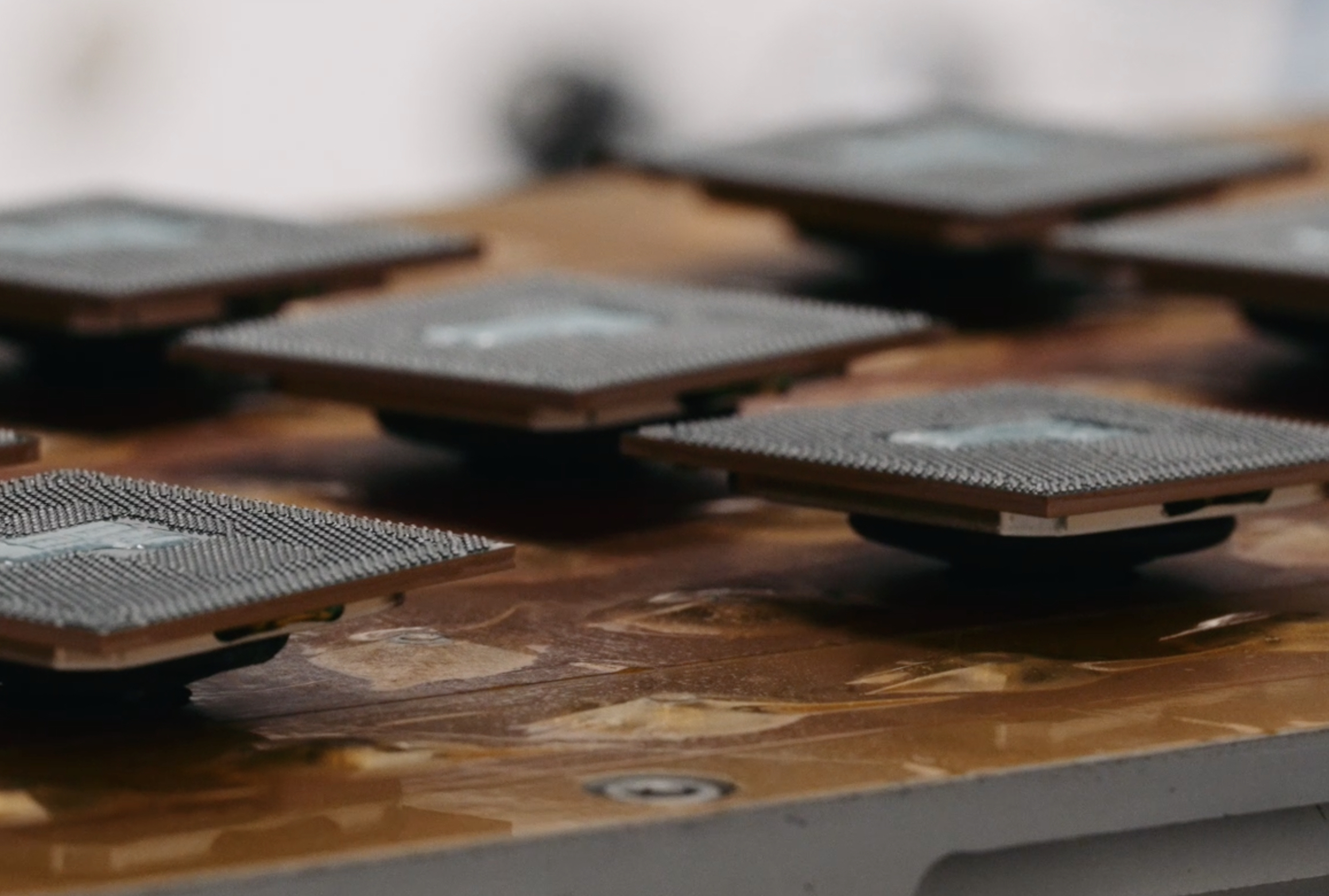 Computer chips on a wooden surface.